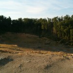 This is the blasted area hidden from view. One picture doesn't really convey the scale; that immense Super Walmart nearby could have easily been housed here with room to spare. Tree removal has left the whole place ripe for destructive erosion. Gullies and mud pits already pock mark the entire site.